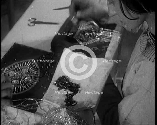 Young Female Civilian Embroidering a Piece of Fabric in an Arts Class, 1920. Creator: British Pathe Ltd.