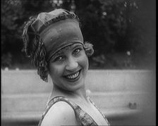 Young Female Civilian Wearing a Jaunty Swimming Hat Posing for the Camera, 1920. Creator: British Pathe Ltd
