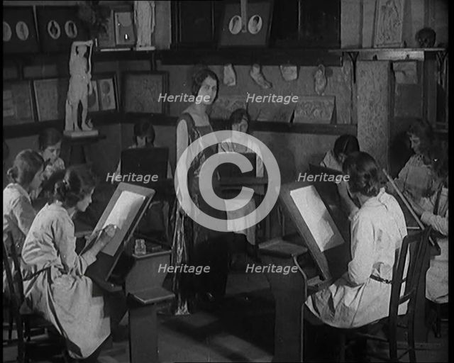 Young Female Civilian Wearing a Long Dress Posing for an All Female Arts Class, 1920. Creator: British Pathe Ltd.