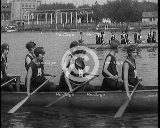 Young Female Civilians Wearing a Team Sport Outfit in a Rowing Race, an Audience Is Seen on..., 1920 Creator: British Pathe Ltd.
