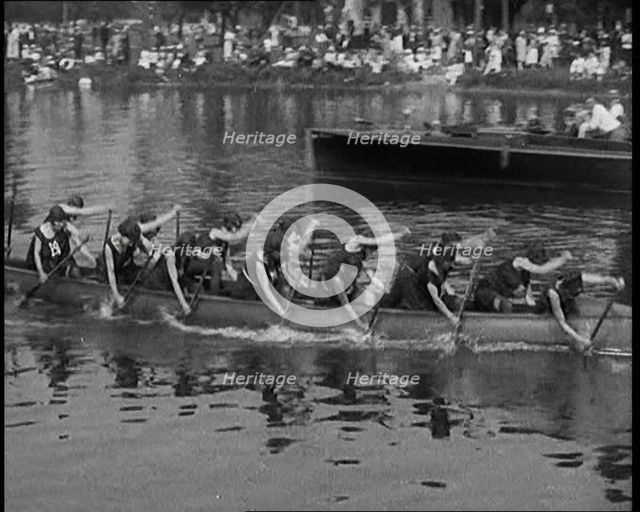 Young Female Civilians Wearing a Team Sport Outfit in a Rowing Race, an Audience Is Seen on..., 1920 Creator: British Pathe Ltd.
