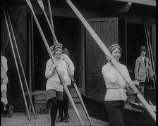 Young Female Civilians Wearing Sport Outfits Carrying Rowing Blades Arriving for a Rowing Class,1920 Creator: British Pathe Ltd