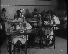 Young Female Civilians Operating Sewing Machines in an Arts Class, 1920. Creator: British Pathe Ltd