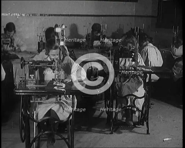 Young Female Civilians Operating Sewing Machines in an Arts Class, 1920. Creator: British Pathe Ltd.