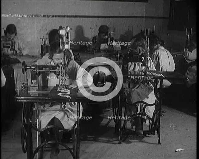 Young Female Civilians Operating Sewing Machines in an Arts Class, 1920. Creator: British Pathe Ltd.