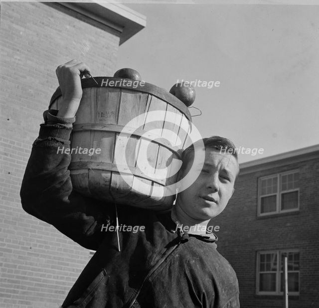 Young huckster in the Southwest section, Washington, D.C., 1942. Creator: Gordon Parks.