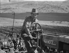 Young Idaho farmer plowing...Ola self-help sawmill co-op..., Gem County, Idaho, 1939. Creator: Dorothea Lange