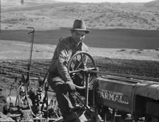 Young Idaho farmer plowing...Ola self-help sawmill co-op..., Gem County, Idaho, 1939. Creator: Dorothea Lange
