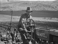 Young Idaho farmer plowing...Ola self-help sawmill co-op..., Gem County, Idaho, 1939. Creator: Dorothea Lange