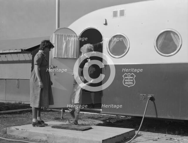 Young mother brings her child to the trailer clinic..., FSA, Merrill, Klamath County, Oregon, 1939. Creator: Dorothea Lange.
