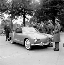 Young men admire the new Volkswagen Karmann Ghia, Landskrona, Sweden, 1955. Creator: Unknown