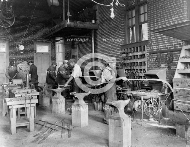 Young men training in blacksmithing at Hampton Institute, Hampton, Virginia, 1899 or 1900. Creator: Frances Benjamin Johnston.
