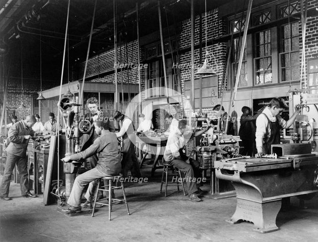 Young men training in use of machinery at Hampton Institute, Hampton, Virginia, 1899 or 1900. Creator: Frances Benjamin Johnston.