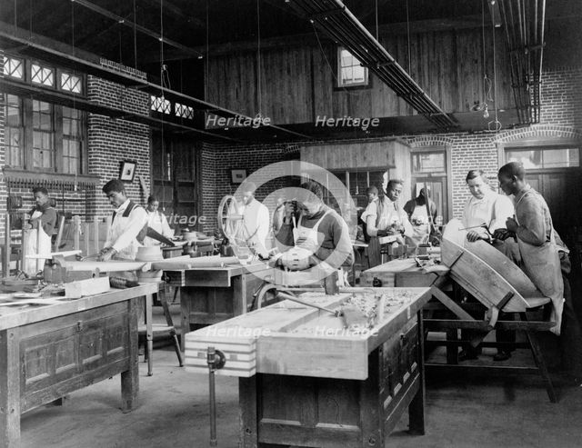 Young men training in wheel wrighting at Hampton Institute, Hampton, Virginia, 1899 or 1900. Creator: Frances Benjamin Johnston.