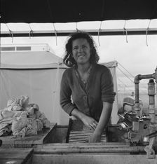 Young migrant girl makes use of facilities..., Merrill FSA camp, Klamath County, Oregon, 1939. Creator: Dorothea Lange