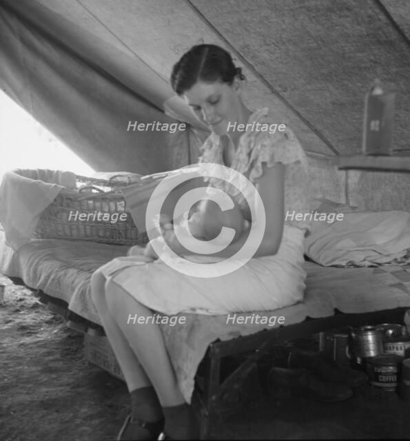 Young migrant mother with six weeks old baby born in a hospital, near Westley, CA, 1939. Creator: Dorothea Lange.