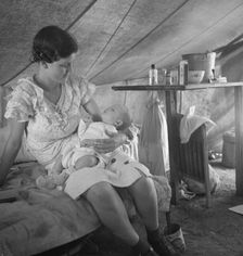Young migrant mother with six weeks old baby born in a hospital with aid..., near Westley, CA, 1939. Creator: Dorothea Lange