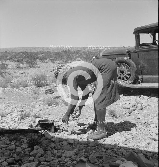 Young Negro wife cooking breakfast, outskirts of El Paso, Texas, 1938. Creator: Dorothea Lange.