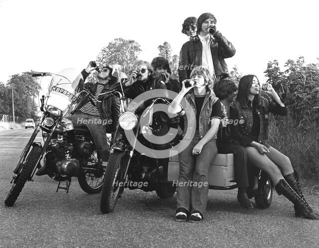 Young people on motorbikes, c1970.