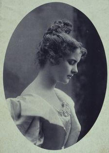 Young woman, facing right, head-and-shoulders profile portrait, c1900. Creator: Davis & Sanford