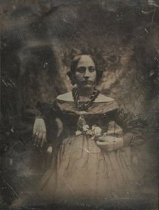 Young woman holding a flower, ca. 1842. Creator: Joseph Philibert Girault De Prangey