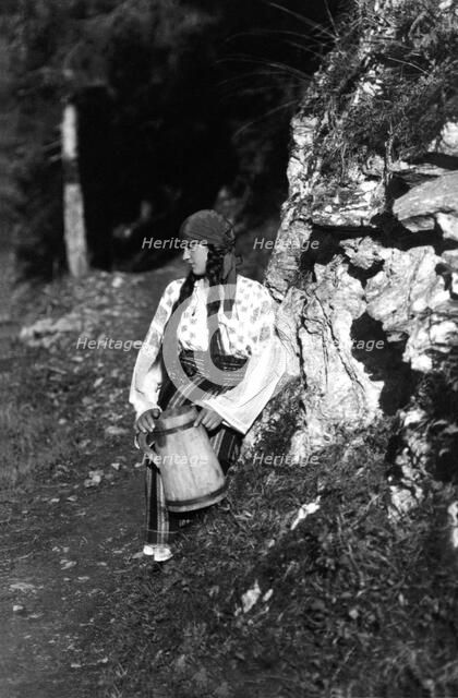 Young woman holding a jug, Bistrita Valley, Moldavia, north-east Romania, c1920-c1945. Artist: Adolph Chevalier