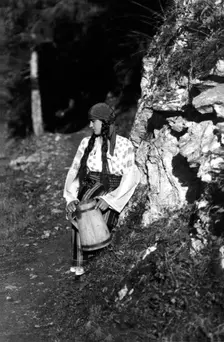 Young woman holding a jug, Bistrita Valley, Moldavia, north-east Romania, c1920-c1945. Artist: Adolph Chevalier