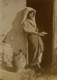 Young woman holding spindles, probably Taormina, Sicily, c1890s. Creator: Count Wilhelm von Gloeden