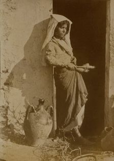 Young woman holding spindles, probably Taormina, Sicily, c1890s. Creator: Count Wilhelm von Gloeden