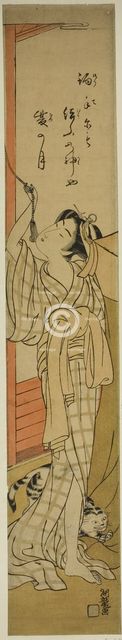 Young Woman Hanging a Mosquito Net as Cat Plays at Her Feet, c. 1774. Creator: Isoda Koryusai.