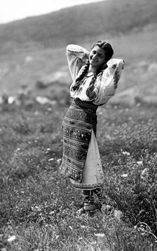 Young woman in traditional costume, Bistrita Valley, Moldavia, north-east Romania, c1920-c1945. Artist: Adolph Chevalier
