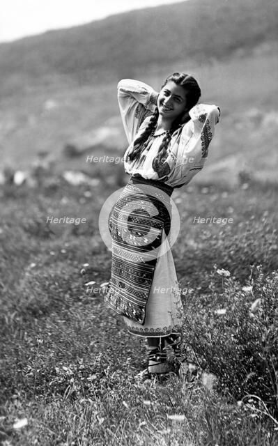Young woman in traditional costume, Bistrita Valley, Moldavia, north-east Romania, c1920-c1945. Artist: Adolph Chevalier