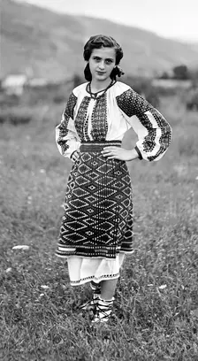 Young woman in traditional dress, Bistrita Valley, Moldavia, north-east Romania, c1920-c1945. Artist: Adolph Chevalier