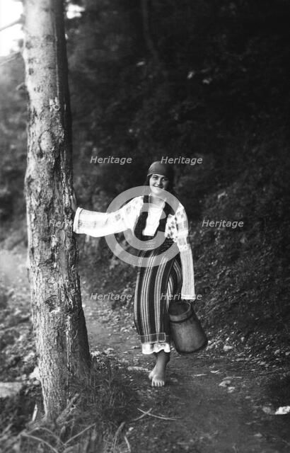 Young woman on a forest path, Bistrita Valley, Moldavia, north-east Romania, c1920-c1945. Artist: Adolph Chevalier