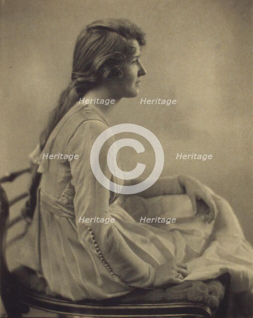 Young woman seated, looking right, 1918. Creator: Unknown.