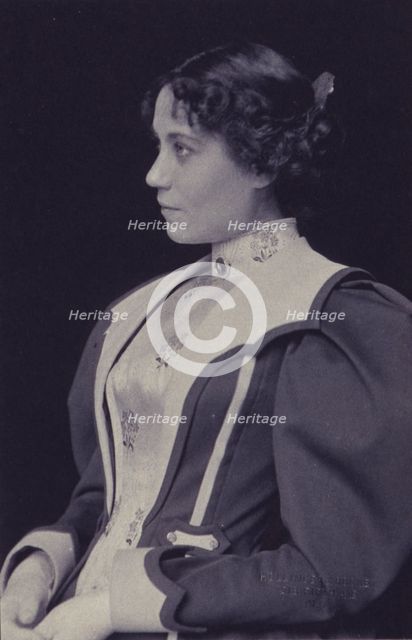 Young woman wearing high collared blouse and mutton-sleeved jacket, facing left..., c1900. Creator: Hollinger & Rockey.