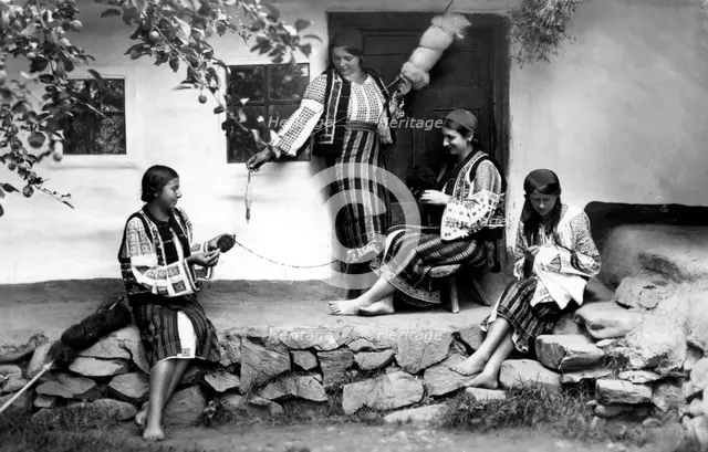 Young women spinning and sewing, Bistrita Valley, Moldavia, north-east Romania, c1920-c1945. Artist: Adolph Chevalier