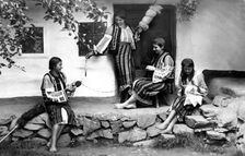 Young women spinning and sewing, Bistrita Valley, Moldavia, north-east Romania, c1920-c1945. Artist: Adolph Chevalier