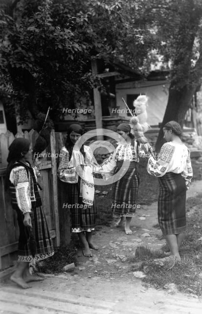 Young women spinning wool, Bistrita Valley, Moldavia, north-east Romania, c1920-c1945. Artist: Adolph Chevalier