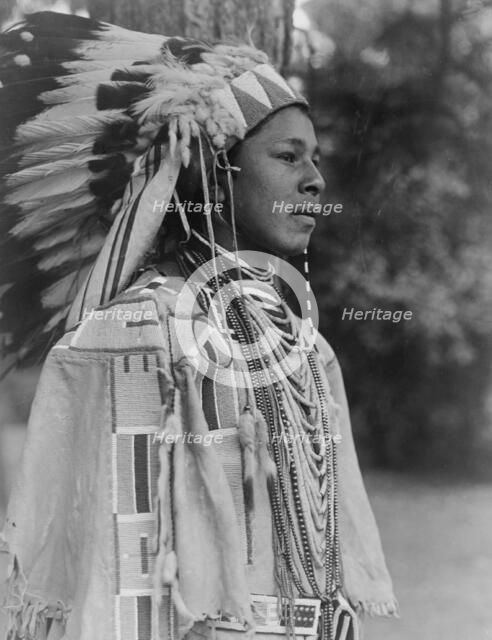 Youth in holiday costume-Umatilla, c1910. Creator: Edward Sheriff Curtis.