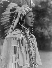 Youth in holiday costume-Umatilla, c1910. Creator: Edward Sheriff Curtis