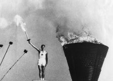 Yoshinori Sakai lights the Olympic cauldron, Summer Olympic Games, Tokyo, 1964. Creator: Unknown