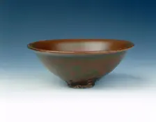 Yaozhou stoneware tea bowl with persimmon red glaze, Jin dynasty, China, 12th century. Creator: Unknown