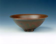 Yaozhou stoneware tea bowl with persimmon red glaze, Jin dynasty, China, 12th century. Creator: Unknown