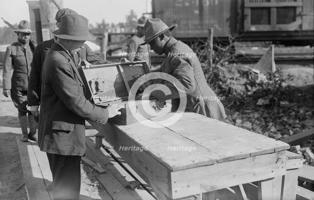 Yaphank, examining packages, 11 Sept 1917. Creator: Bain News Service.