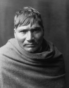 Yaqui man, head-and-shoulders portrait, facing front, c1907. Creator: Edward Sheriff Curtis