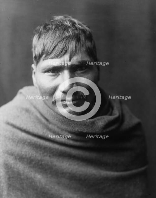 Yaqui man, head-and-shoulders portrait, facing front, c1907. Creator: Edward Sheriff Curtis.