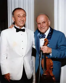 Yehudi Menuhin, American violinist, and Dov Seltzer, Romanian composer, 1992. Creator: Sidney Harris