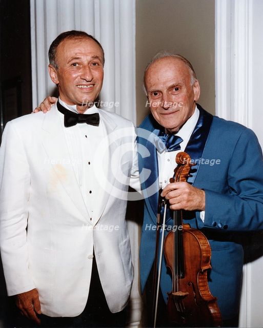 Yehudi Menuhin, American violinist, and Dov Seltzer, Romanian composer, 1992. Creator: Sidney Harris.