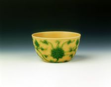 Yellow cup with lotus scrolls in green enamel, Yongzheng period, Qing dynasty, China, 1723-1735. Creator: Unknown